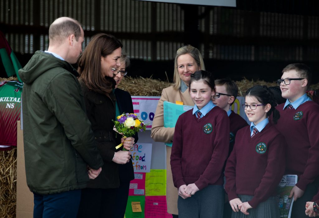 The royal couple with students from Kiltale National School