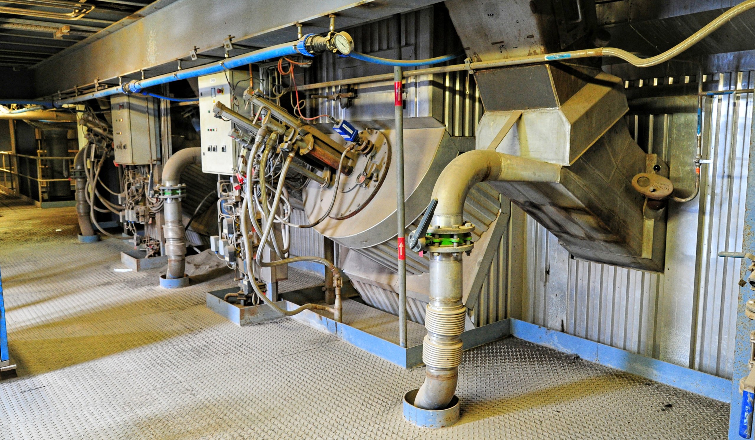 At the level where the mixture and air enter the furnace