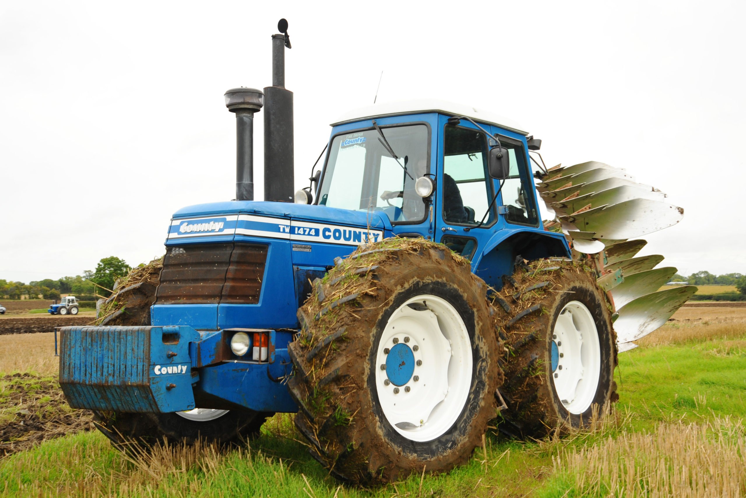 The equal-sized wheels on County tractors restricted turning but were still popular on heavy land