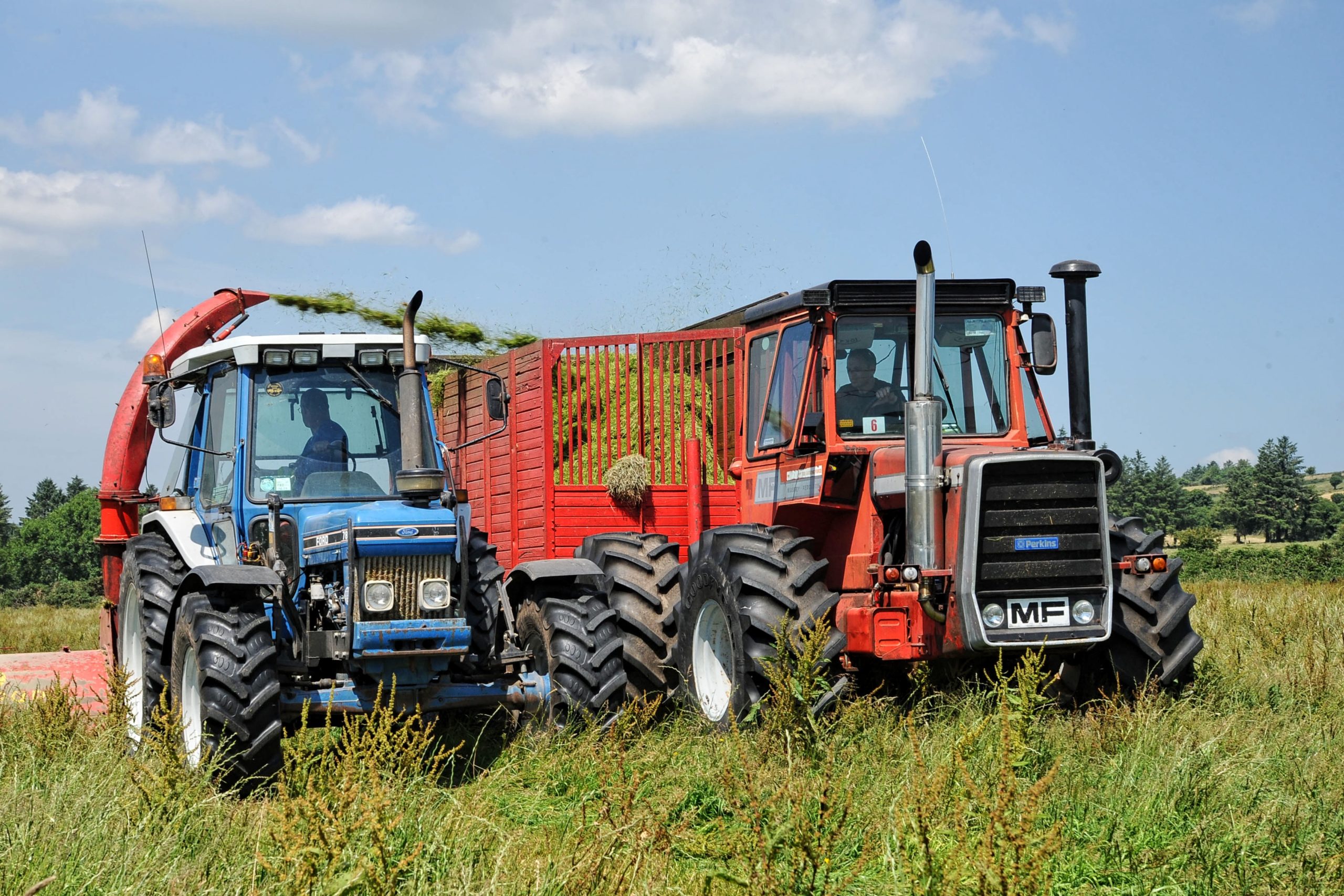 A Massey Ferguson 1200 working alongside a standard Ford 7810
