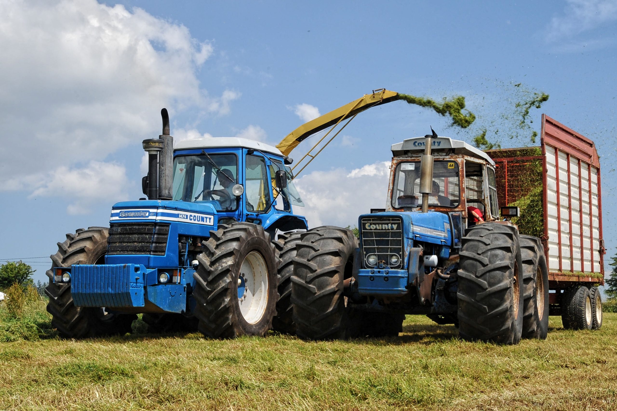A County 1474 powering a double chop harvester