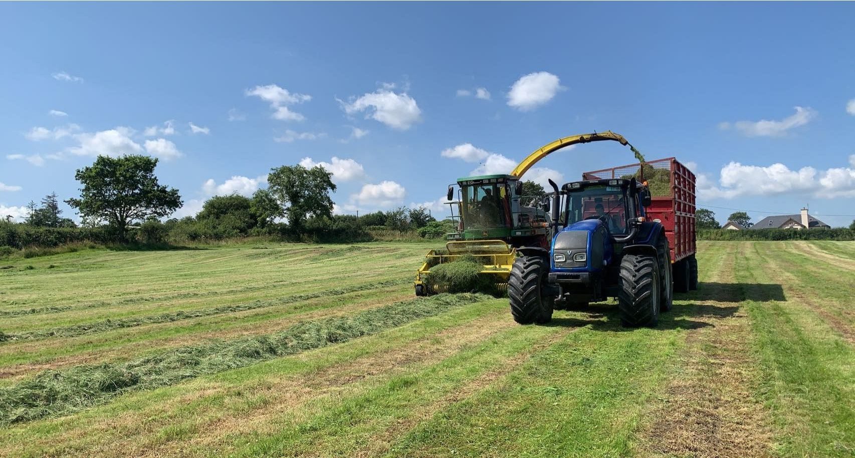 Paddy Lane in the harvester and Amy Brouder driving the tractor