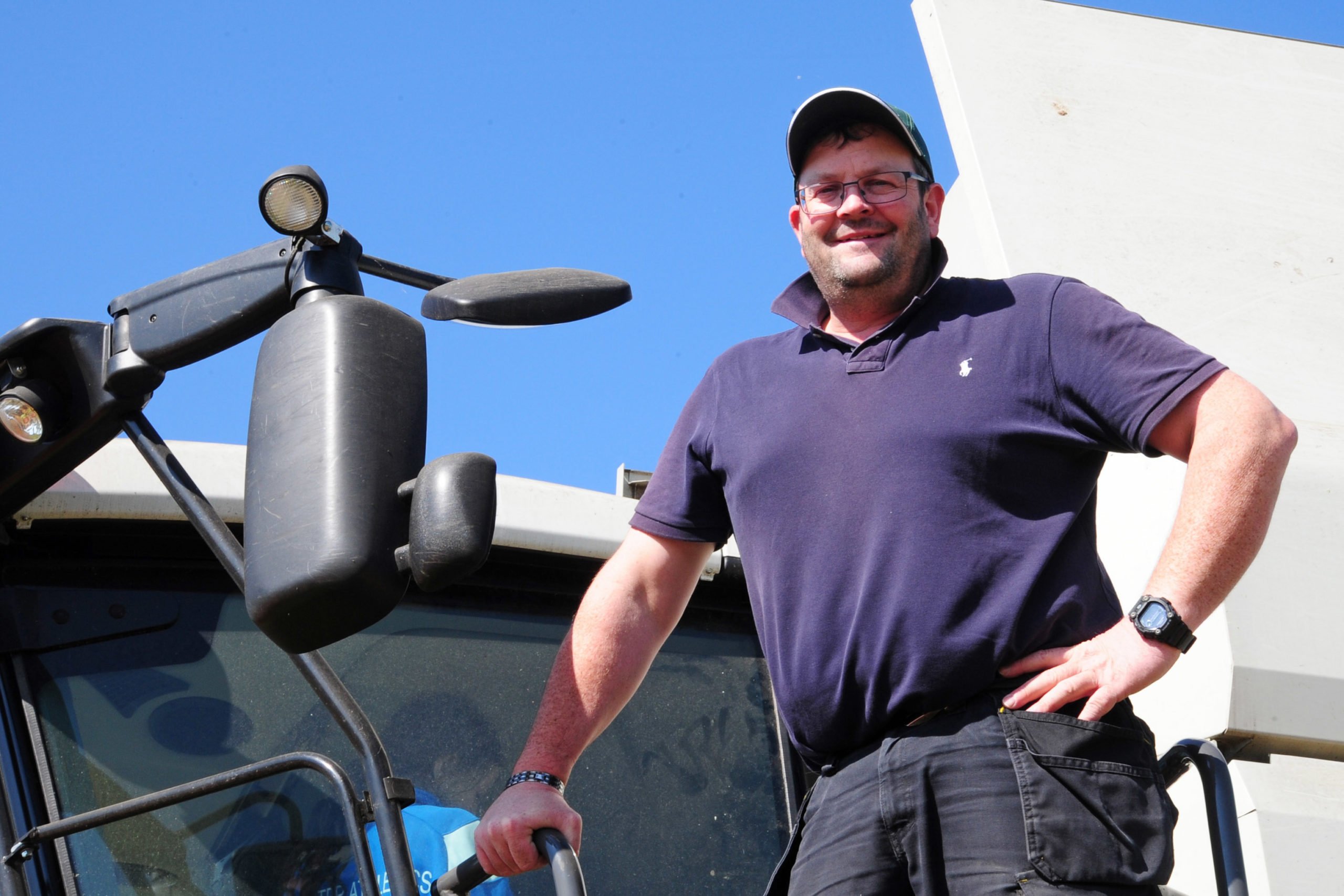 Jeremy O'Toole on the steps of the Lexion 7500