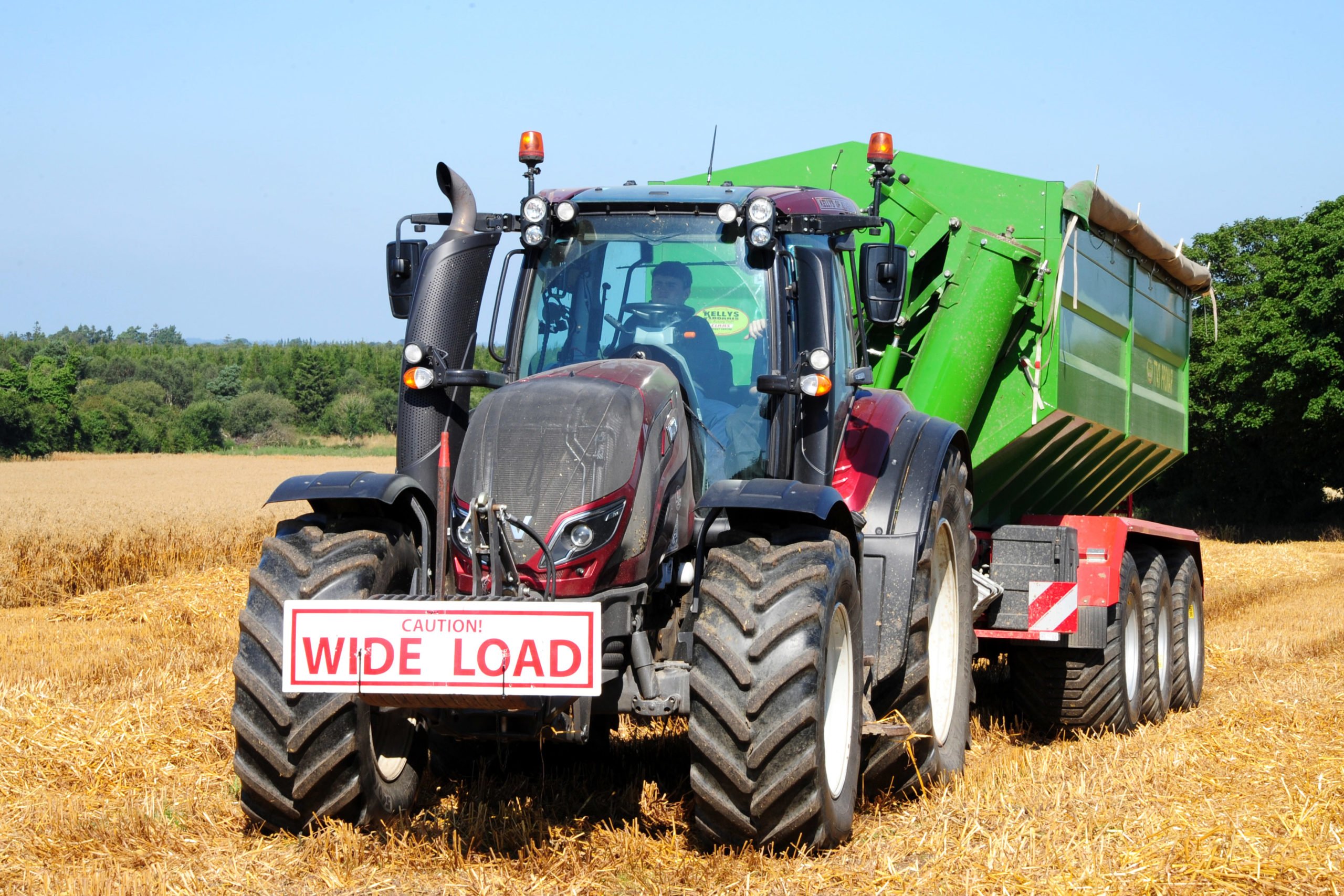 A fleet of Valtras pull the chaser bins