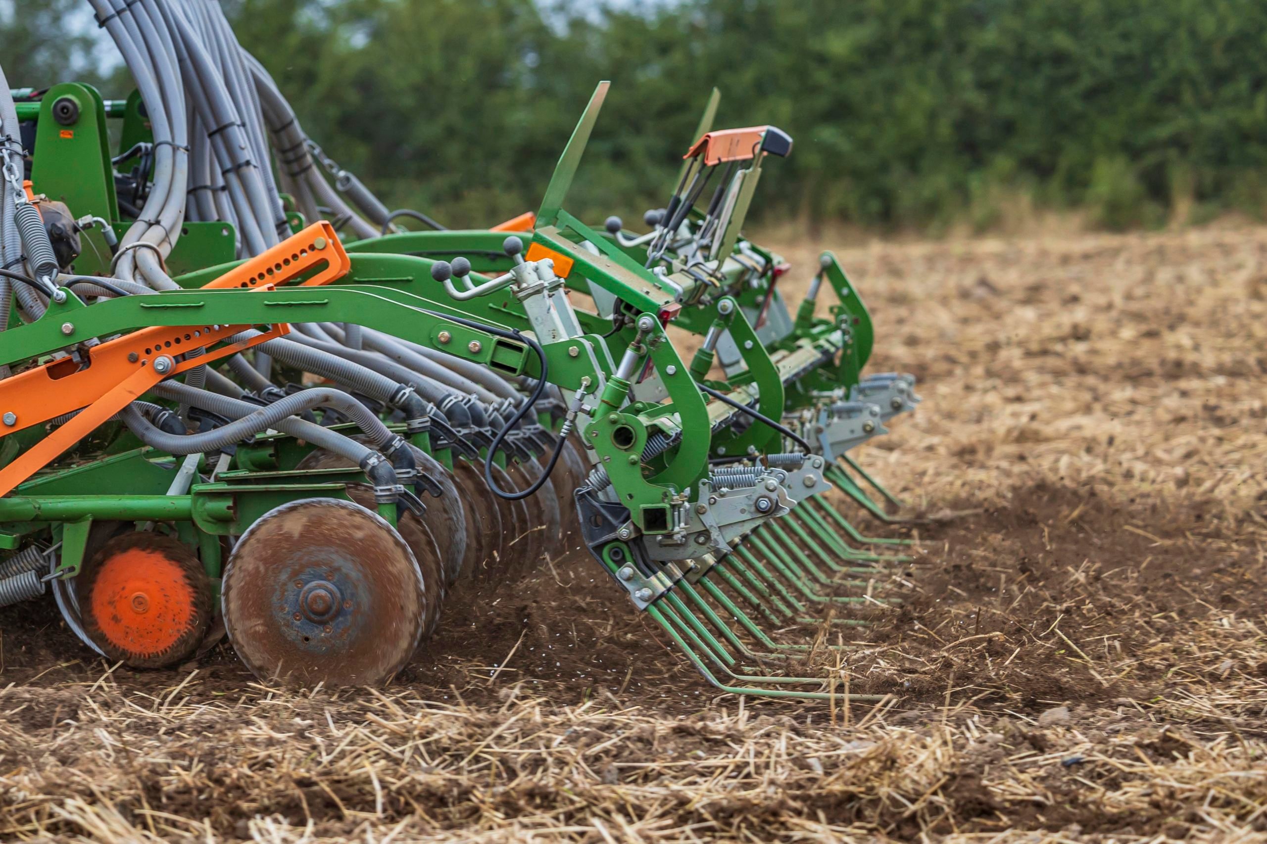 The rear tines act to cover the seed