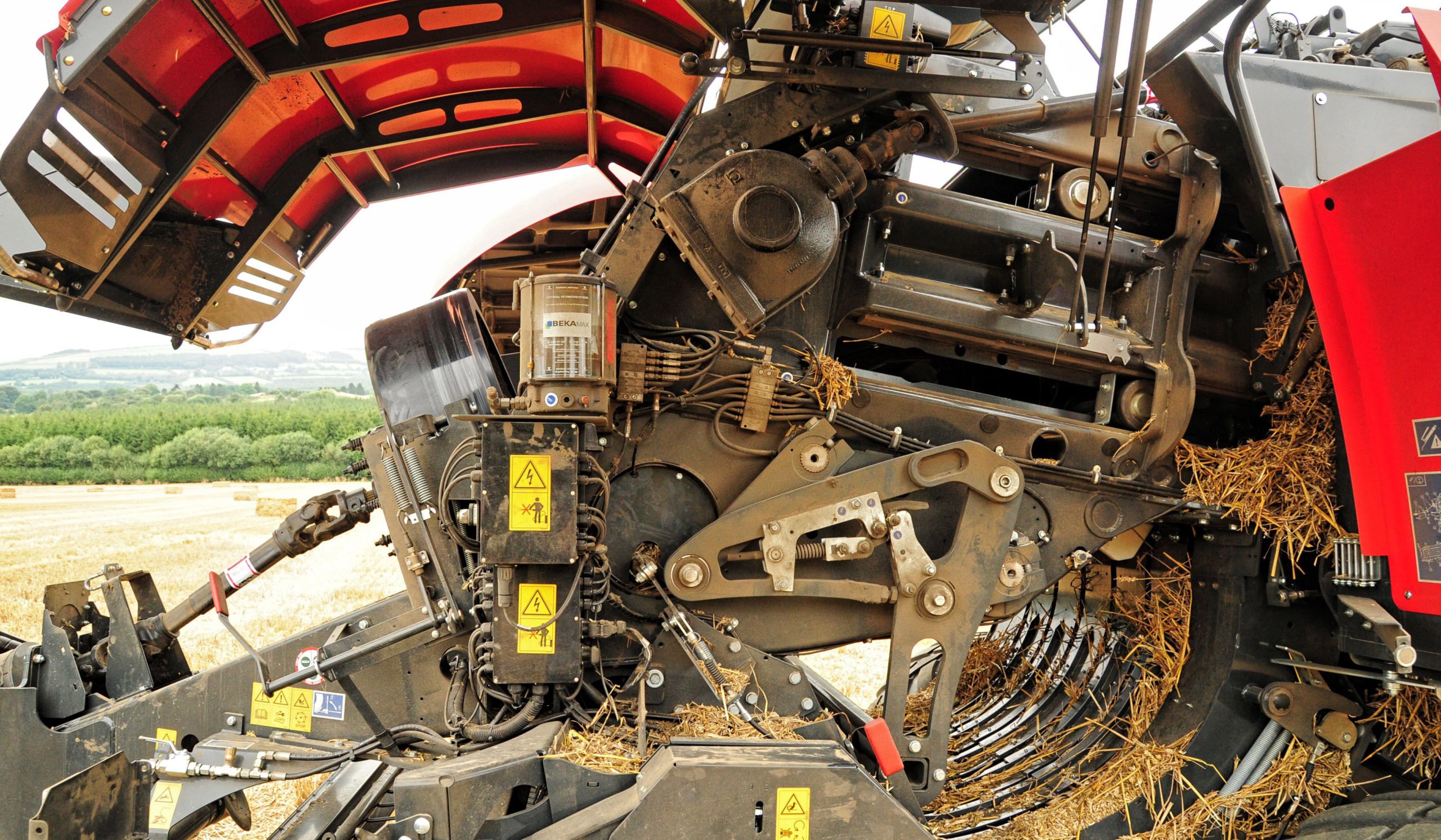 The feed forks push the material into a flake formation chamber located below the path of the plunger