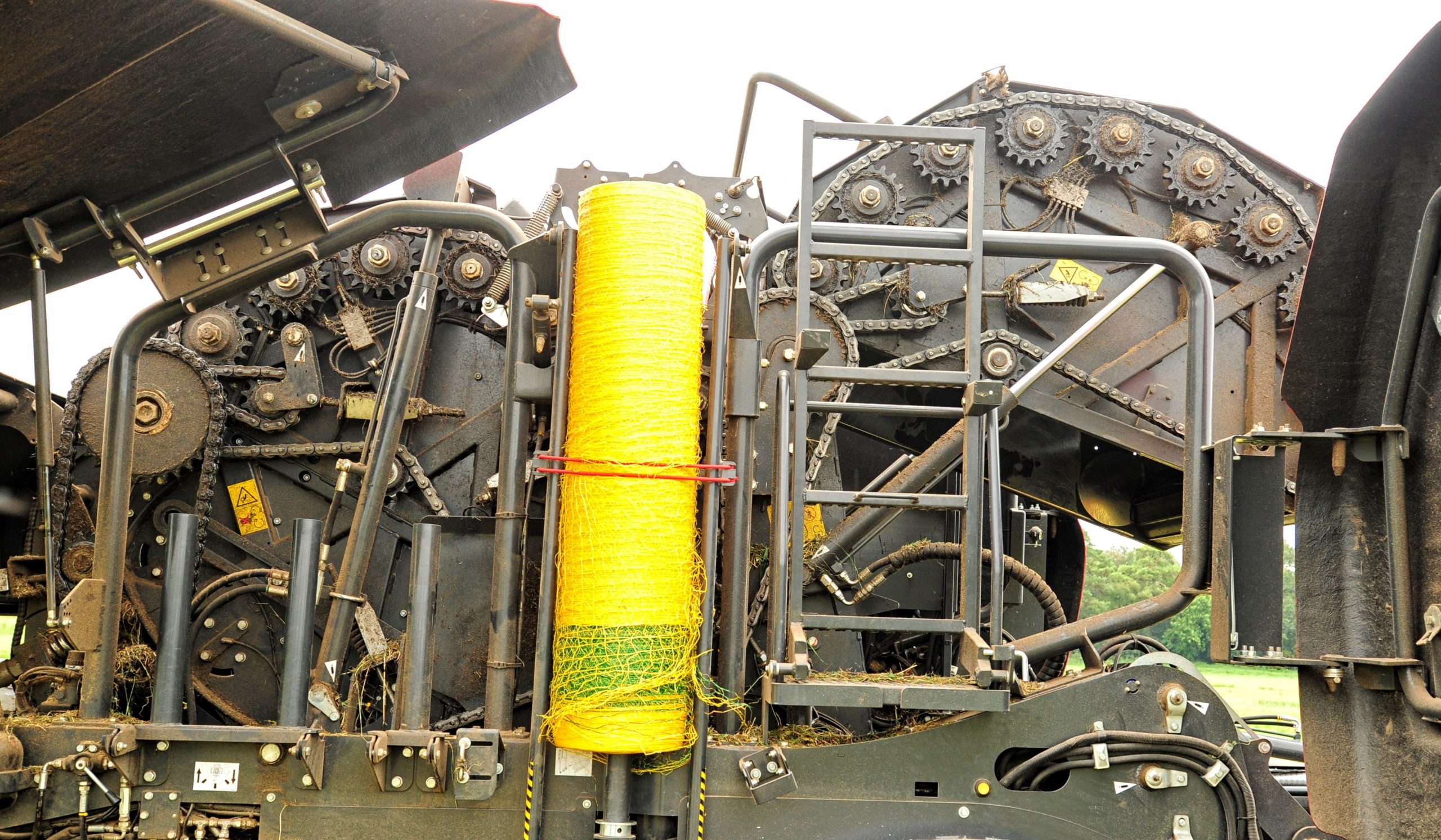 In this side view, the 2 chambers can be seen, one either side of the spare roll of net. The main chamber, on the right, is half open