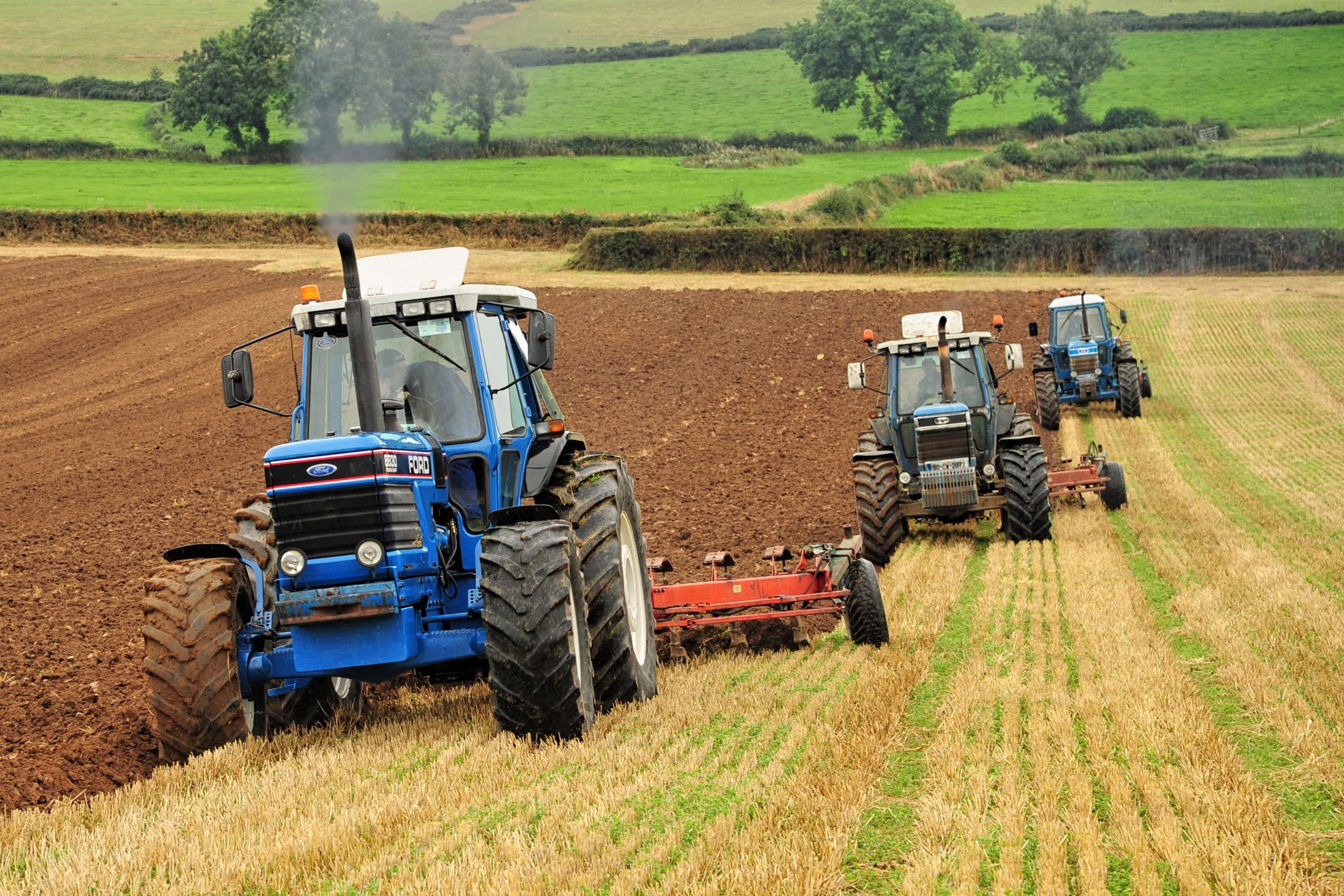 Fields are soon ploughed with three mighty Fords on the job