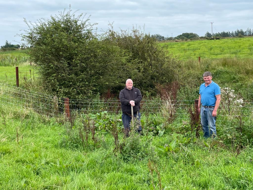 Thomas Rushe, local farmer and manager of Corracreigh GWS, Co. Roscommon, and Tommy Farrell beside a fenced-off swallow hole within the GWS catchment