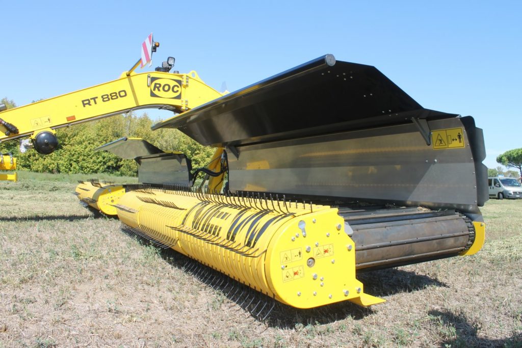 Tines lift the crop onto belts rather than drag it across the ground