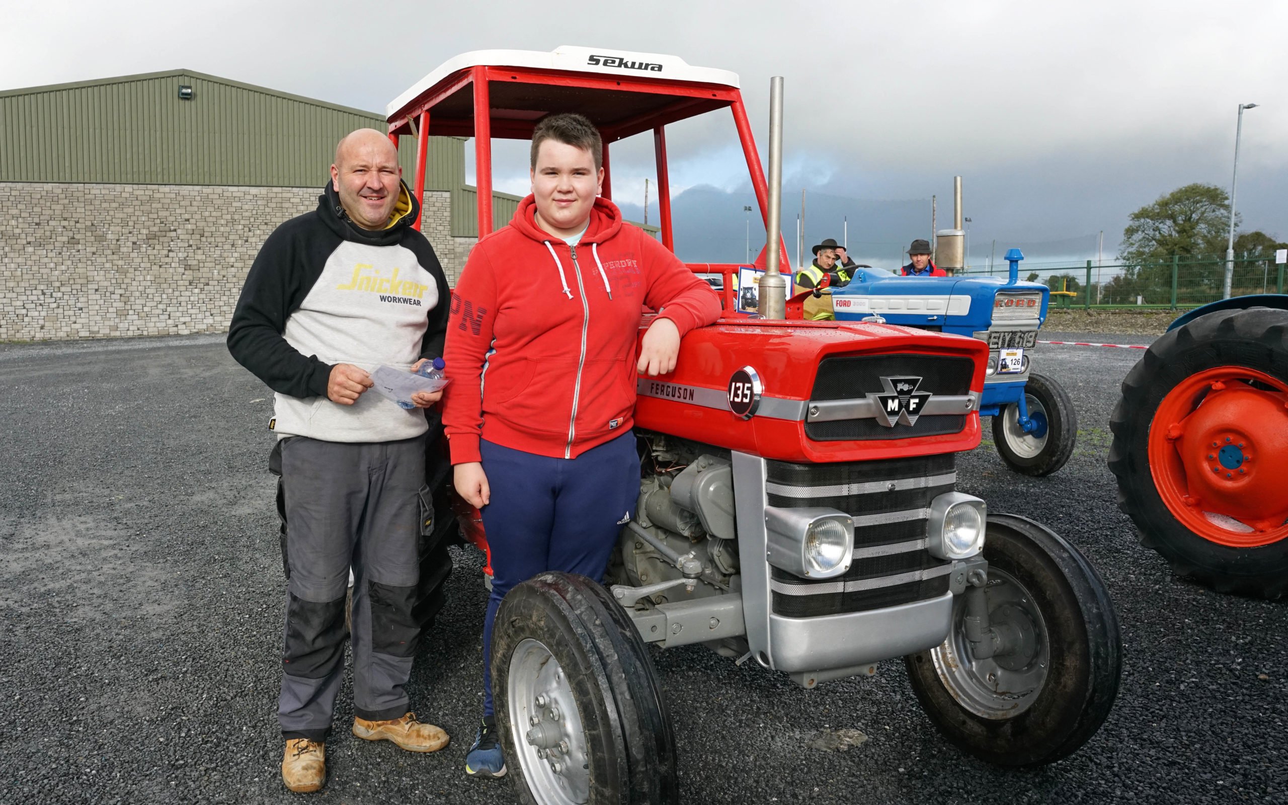 Alex and Brendon Egan alongside the Massey Ferguson 135 restored as a joint project
