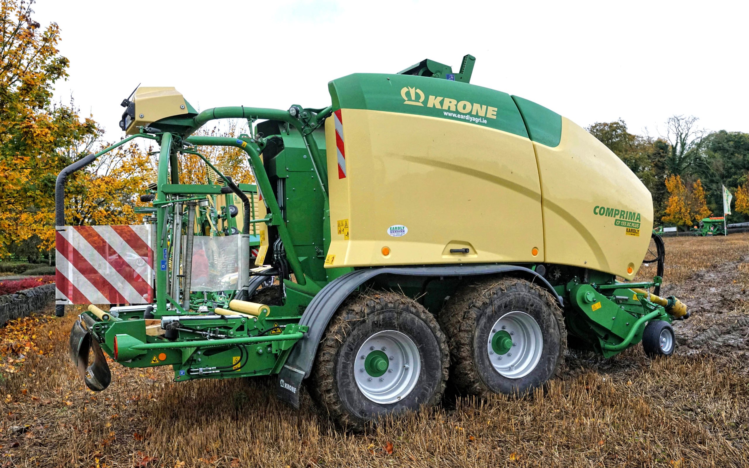 The Krone CF155 XC Plus can place two unwrapped bales on the ground simultaneously to help reduce travel when clearing the field