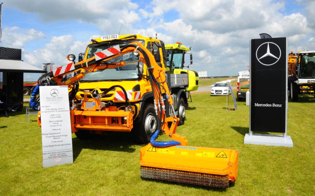 Although an off-road vehicle by design, the Unimog provides a stable platform for road maintenance machinery