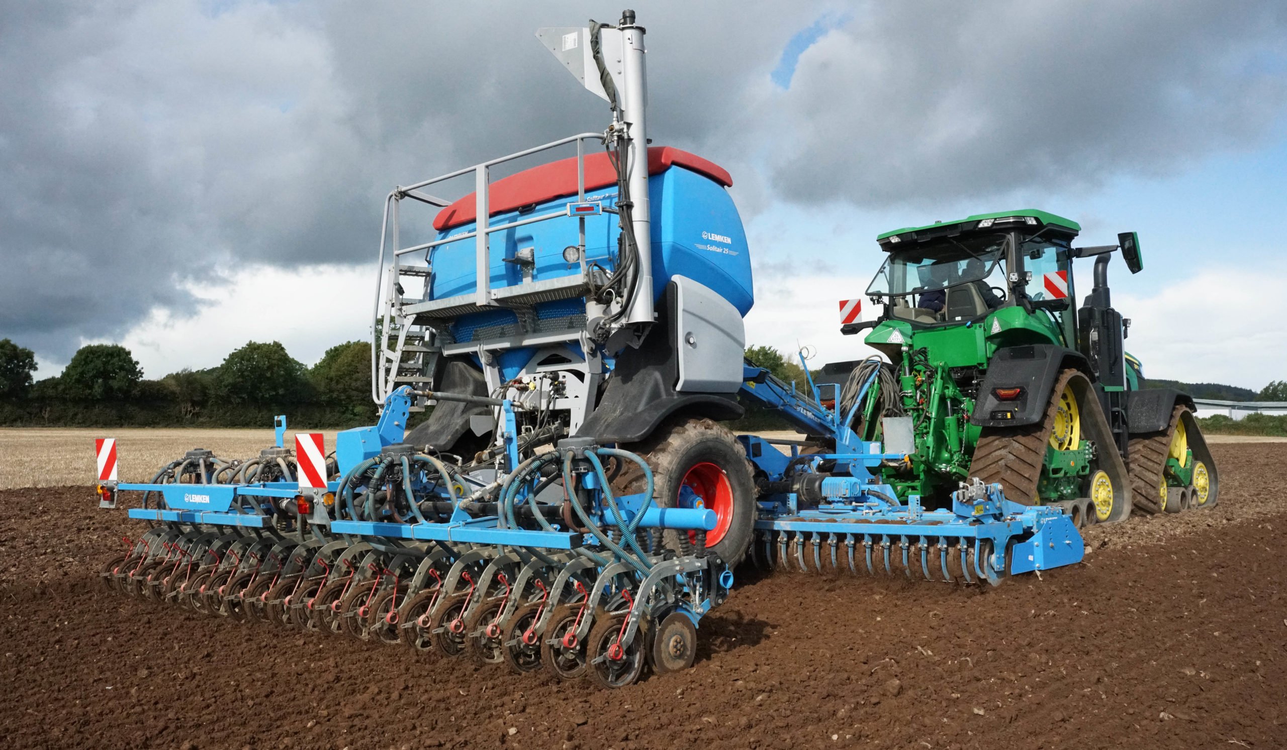 Drama in the sky and on the ground as this impressive unit comprising a JD 8R410 and Lemken Solitar 25 worked the ground at Middleton, Co. Cork