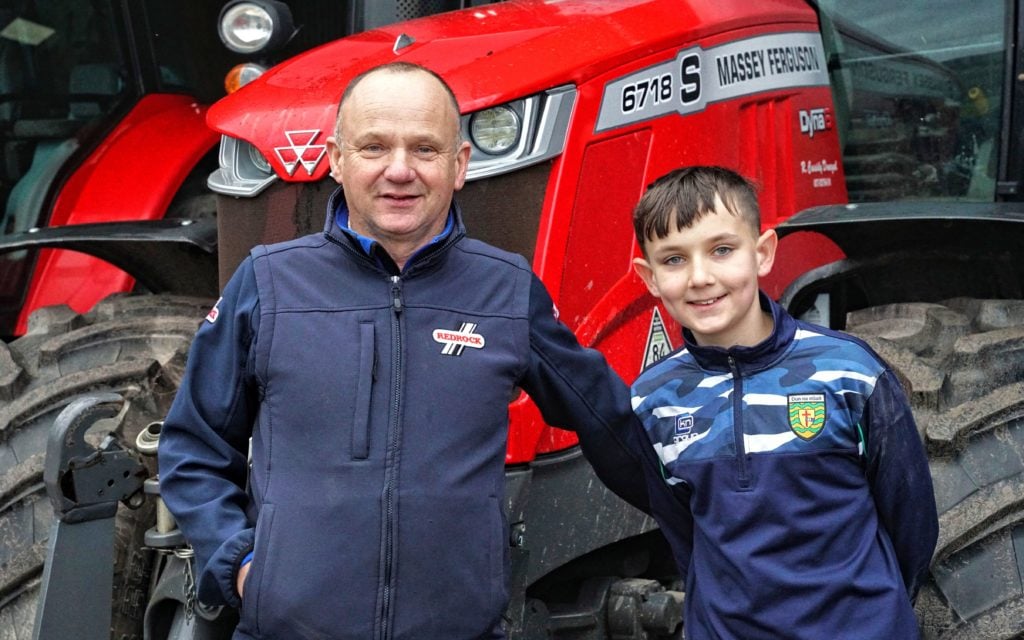 Roland Cassidy with son Calum. Roland had adapted a digger for feeding silage and was keen to share it with Agriland readers