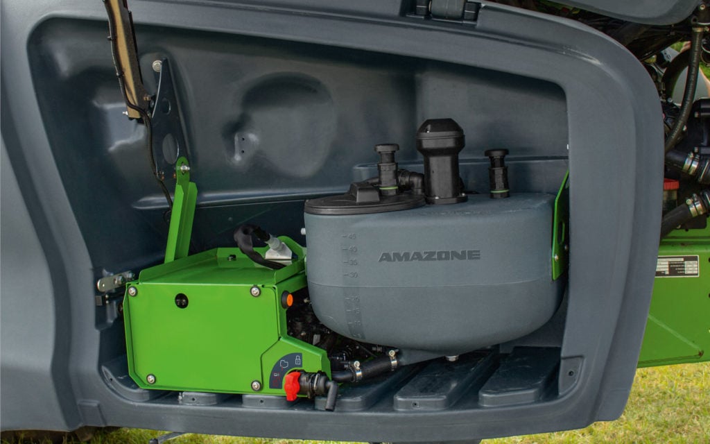 The tank for the neat pesticide is situated in the storage compartment of the sprayer