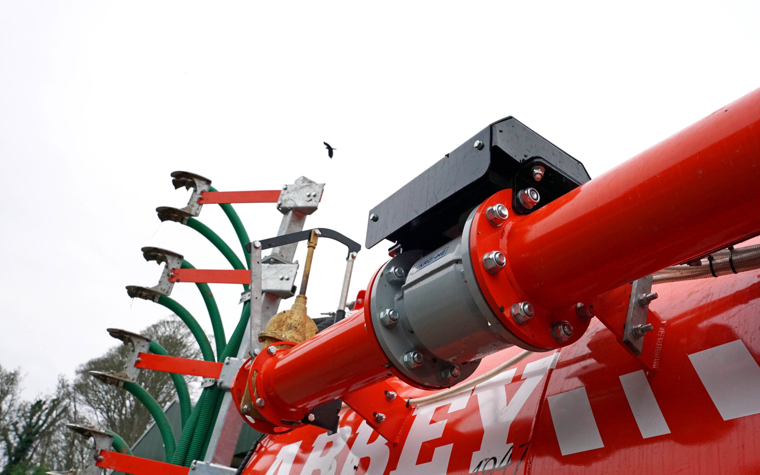 The flow meter and control valve sit high on the side of the tank