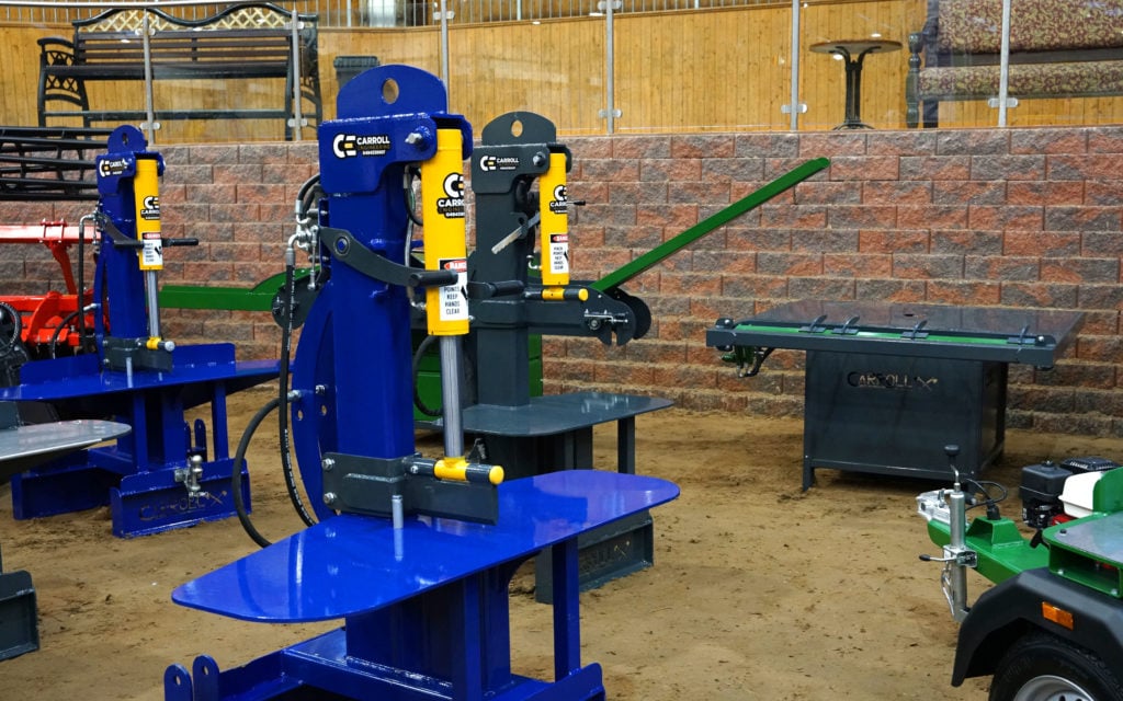 Sturdy log splitters can be driven by PTO, electric motor or independent petrol engine. The pallet breaker can be seen in the background