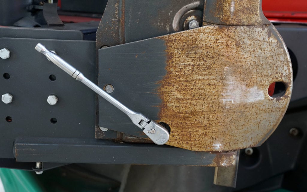 Oil may be drained from the lower end of the bed when in the upright position