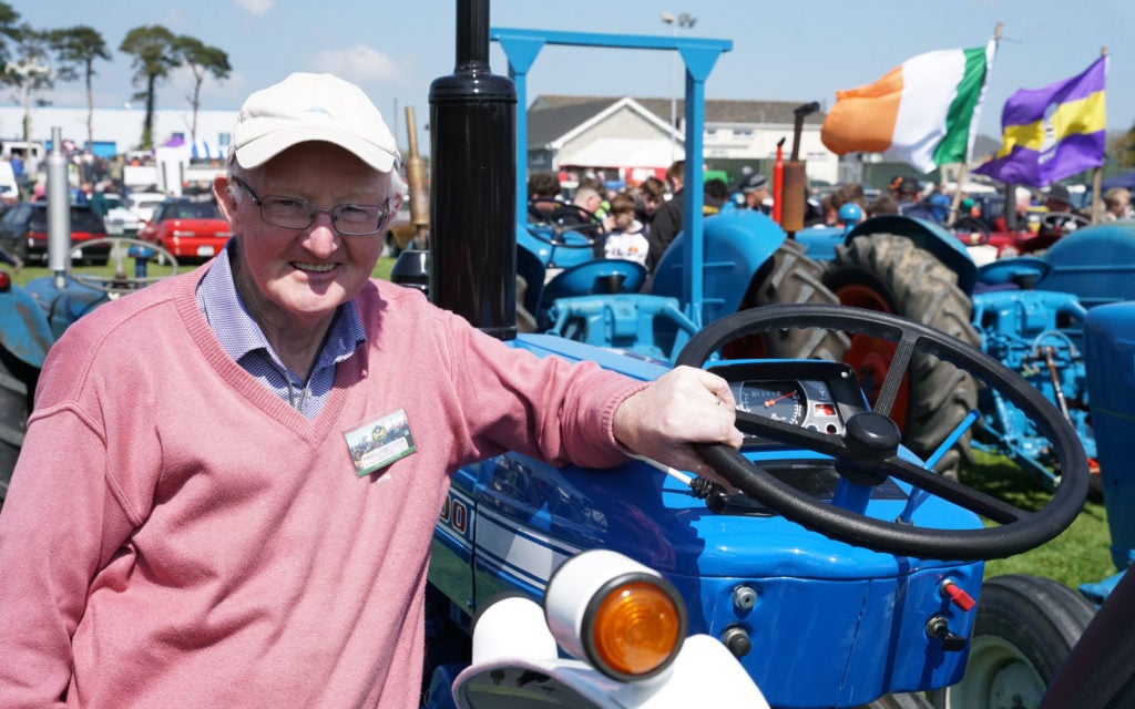Sean Phelan stands behind his Ford 2000 which has been restored for 10 years now but looks as if it was done last week