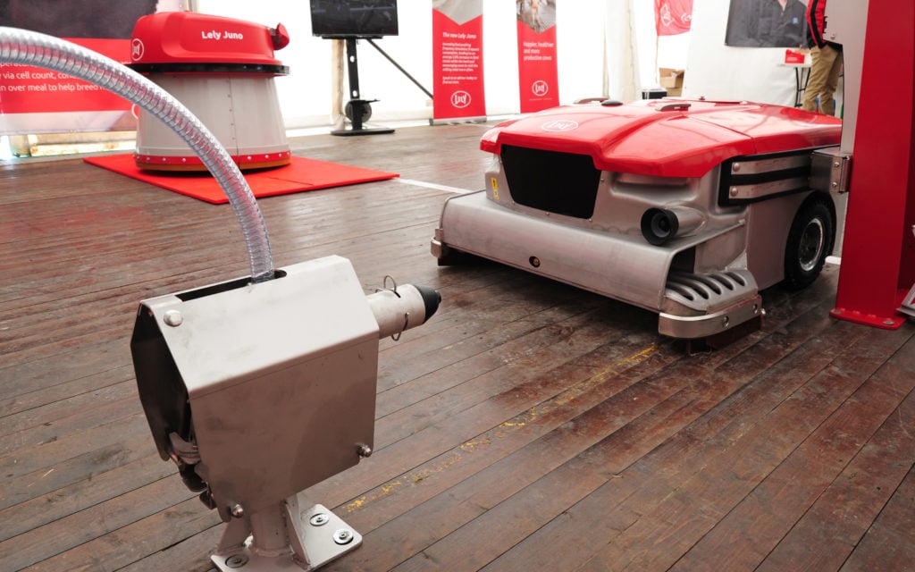 The Lely Discovery 120 Collector can discharge through the slats in a shed floor or via a dedicated discharge unit, as shown here