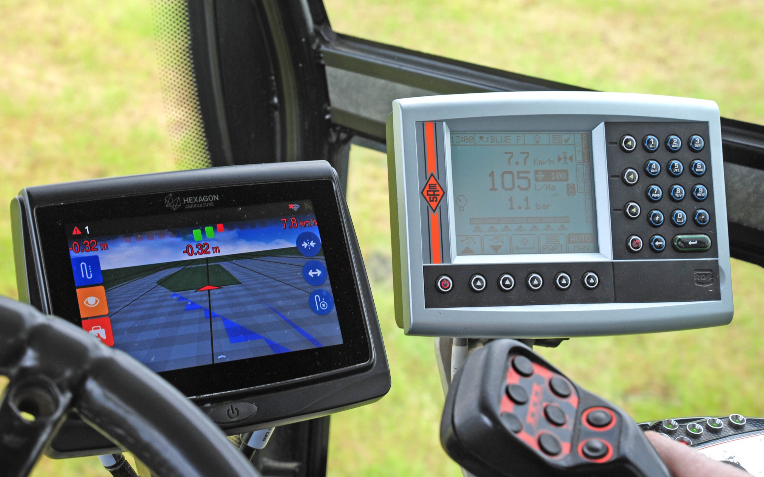 Two screens, one for GPS and the other for the spraying parameters