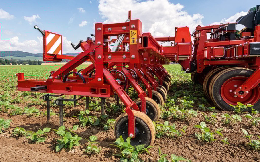 The frame sits between the tractator and hoe and upgrades it to automatic steering