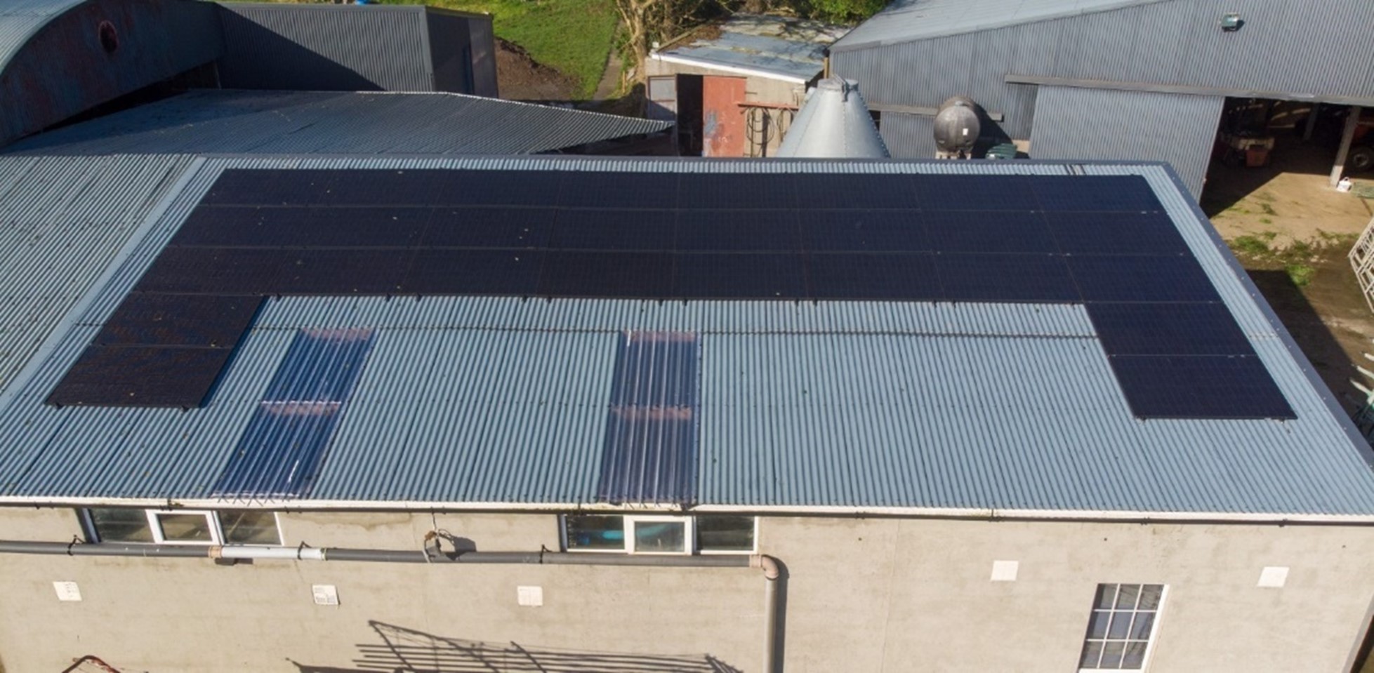 Solar PV powering a milking parlour on a corrugated shed roof