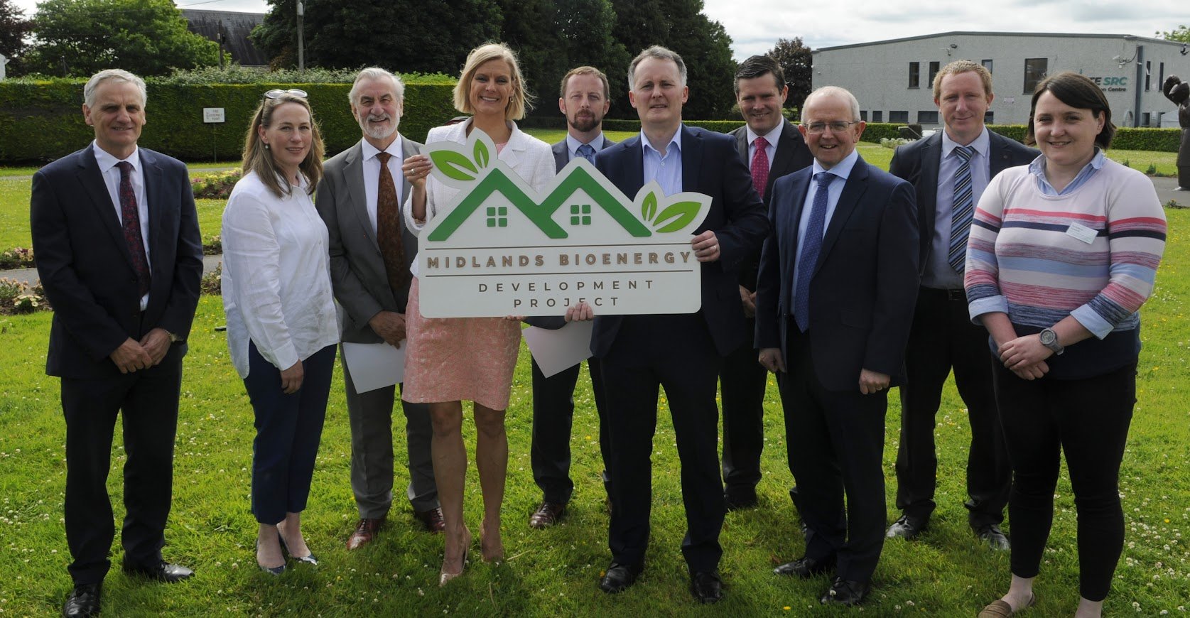 L-R: Tom Shanahan, Offaly County Council; Sarah Morgan, Midlands Regional Enterprise Plan; Kieran Mulvey, Just Transition commissioner; Minister Hackett; Paddy Phelan, IrBEA president; Pádraic Ó hUiginn, project executive; Seán Finan, IrBEA CEO; Pat Gallagher, CEO Westmeath County Council; Noel Gavigan, IrBEA technical Executive; Dr. Isabella Donnelly, regional coordinator and Westmeath county mentor, Sustainable Energy Communities. Image source: IrBEA