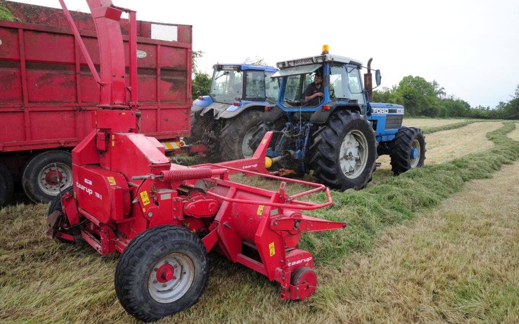 20 years old and still in excellent condition, the Taarup trailed harvester is ideally matched to the Ford 8730