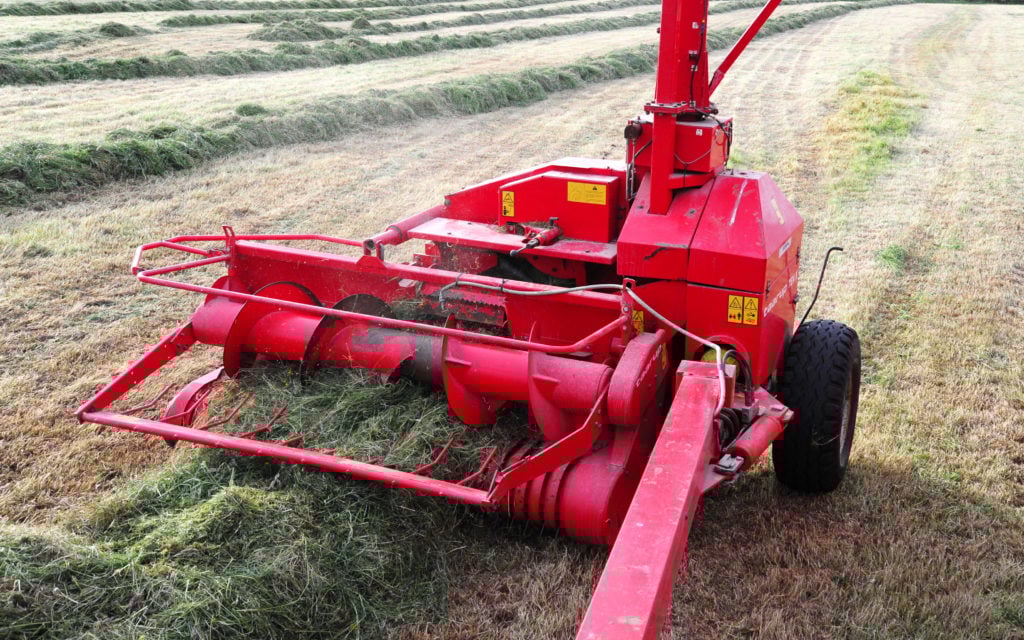 With 3 swathes raked into one, the throat of the harvester was at full capacity, but it was not phased, nor was the tractor