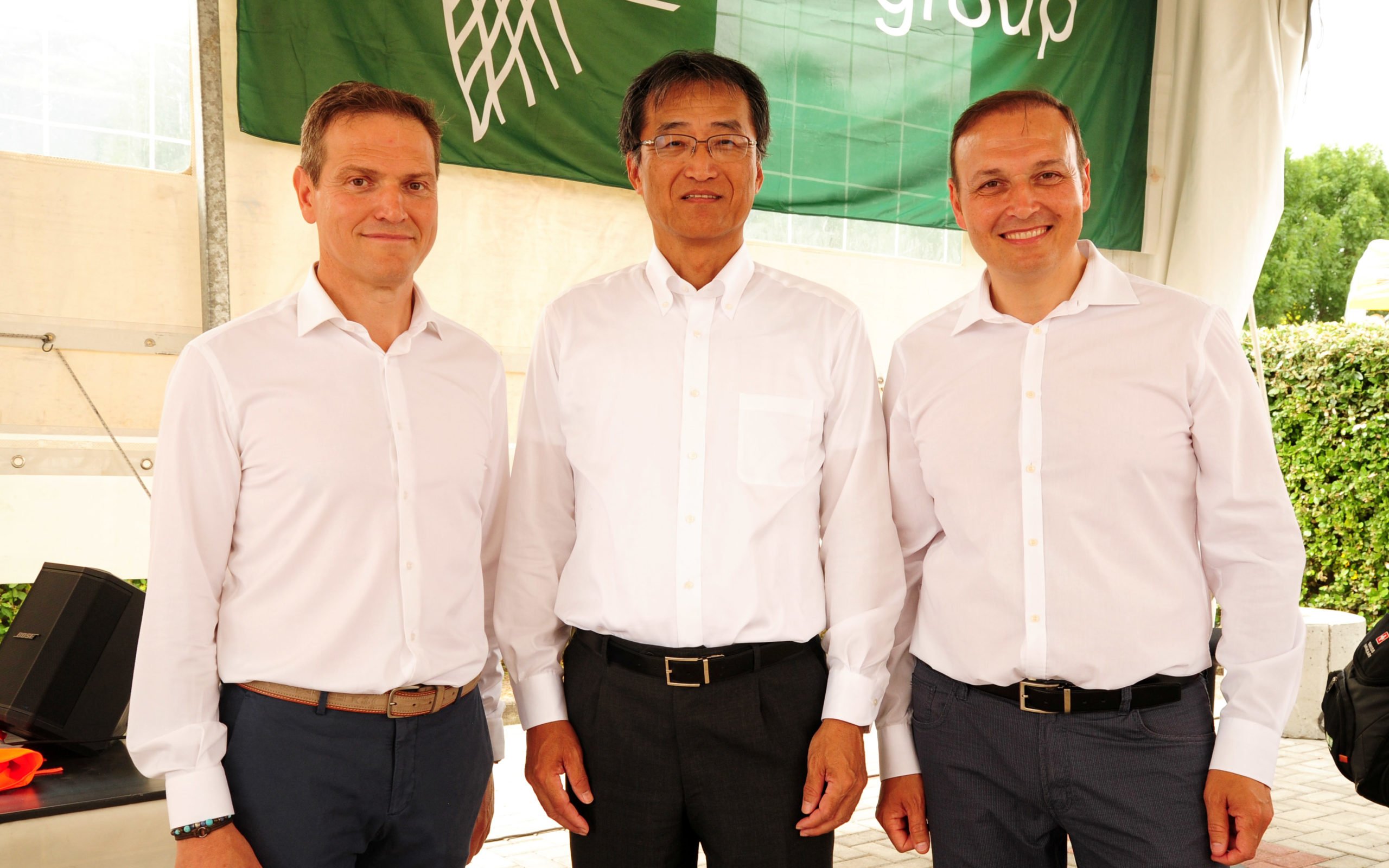 Raffaele, left, and Denis Ubaldi with Mr Kamada, CEO of Kverneland Group