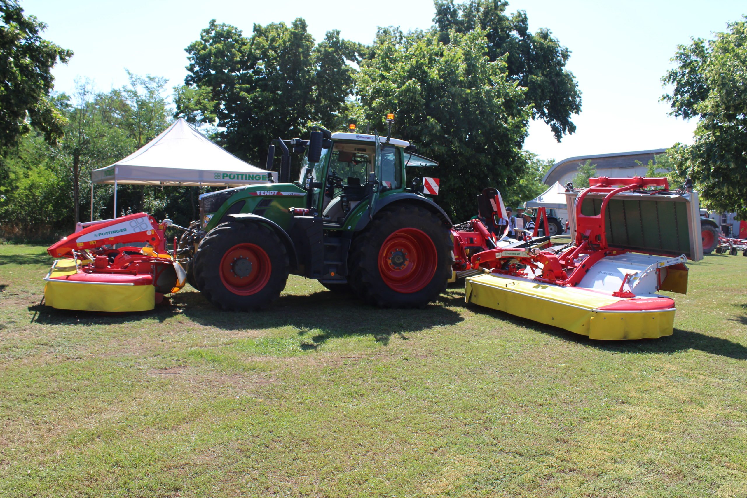 The new NOVACAT V 10000 mower from Pottinger, demonstrating the COLLECTOR cross conveyor belt and CROSS FLOW auger for merging swaths