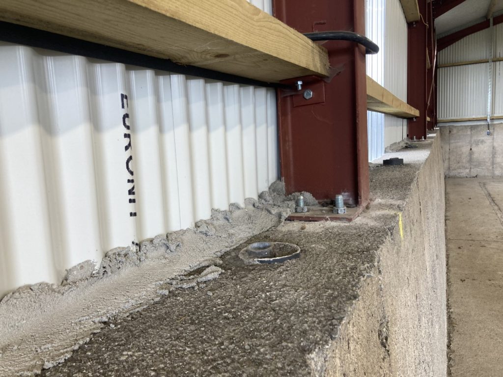 Girders were bolted to the existing walls of the silage slab