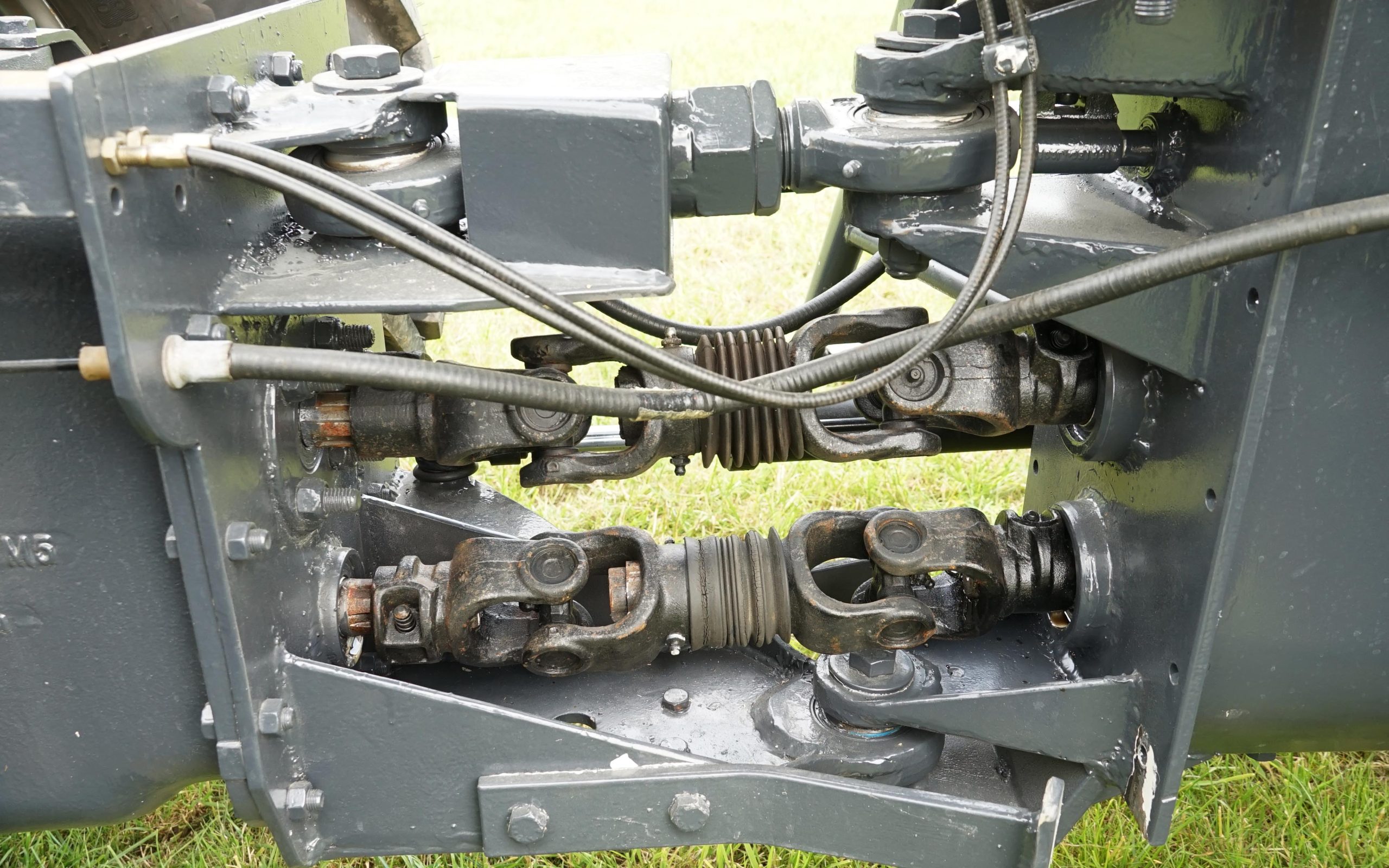 The two hinge points connect the halves together with the PTO shaft, drive shaft, and Bowden cables operating the rear tractor functions