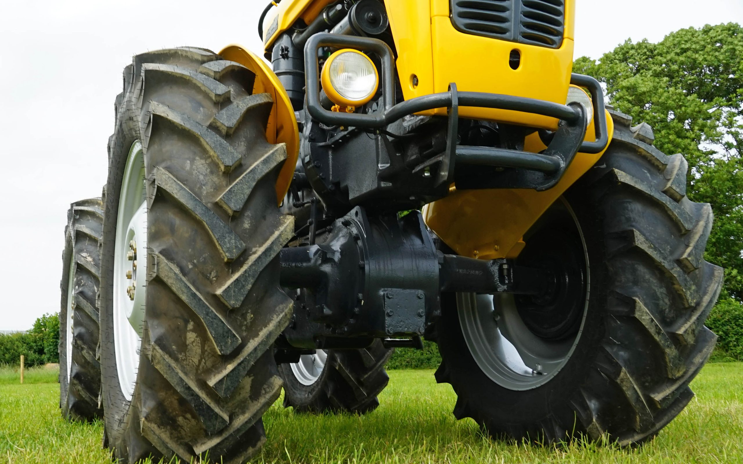 The reversed rear axle unit of a MF 35 can be clearly seen at the front of the tractor