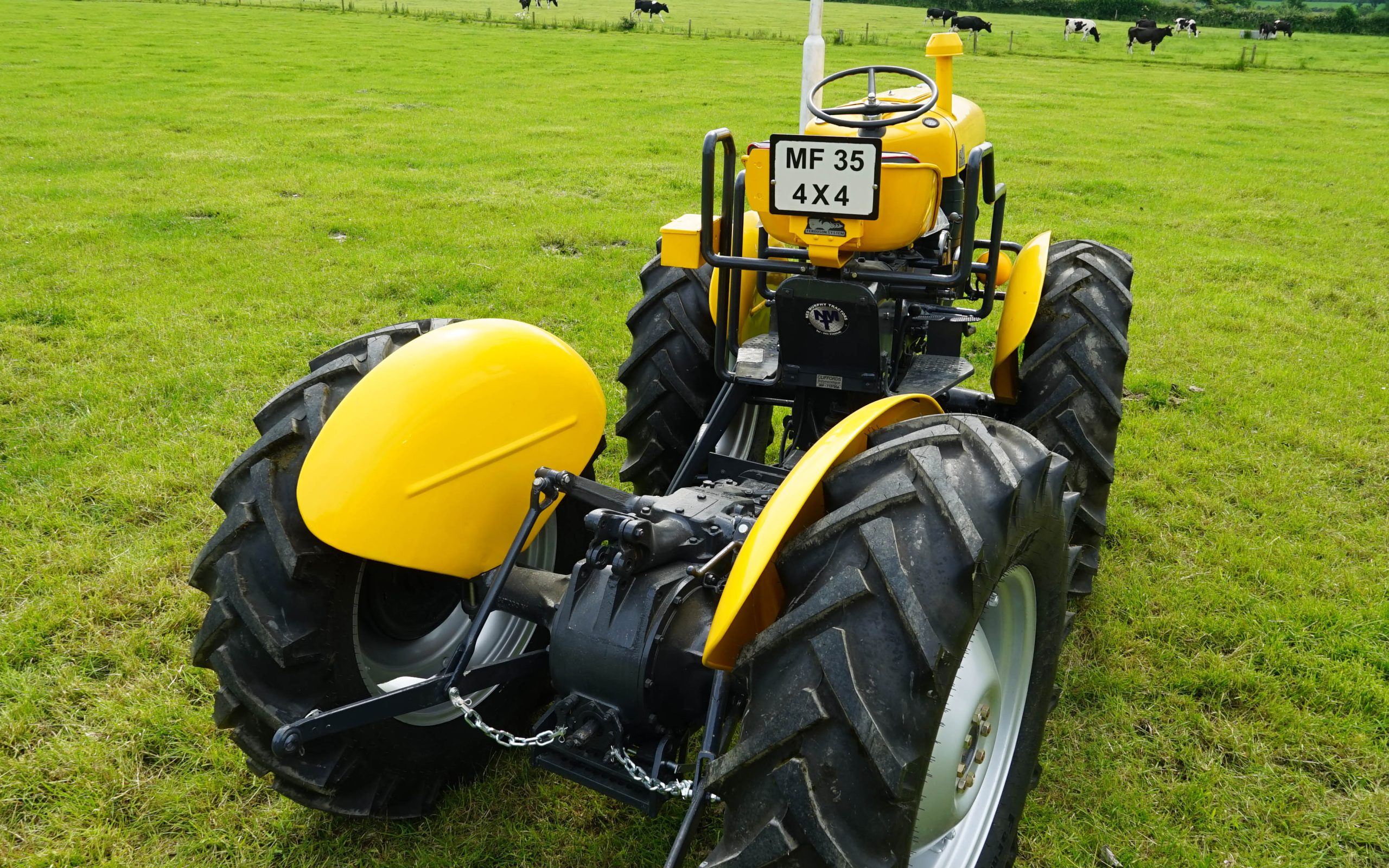 From the rear, the tractor layout does bear a resemblance to a cabless MF1200