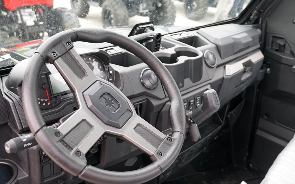 A flashback to the simplicity of cars as they used to be: steering wheel, gear selector, throttle, and brake are all you need to get mobile
