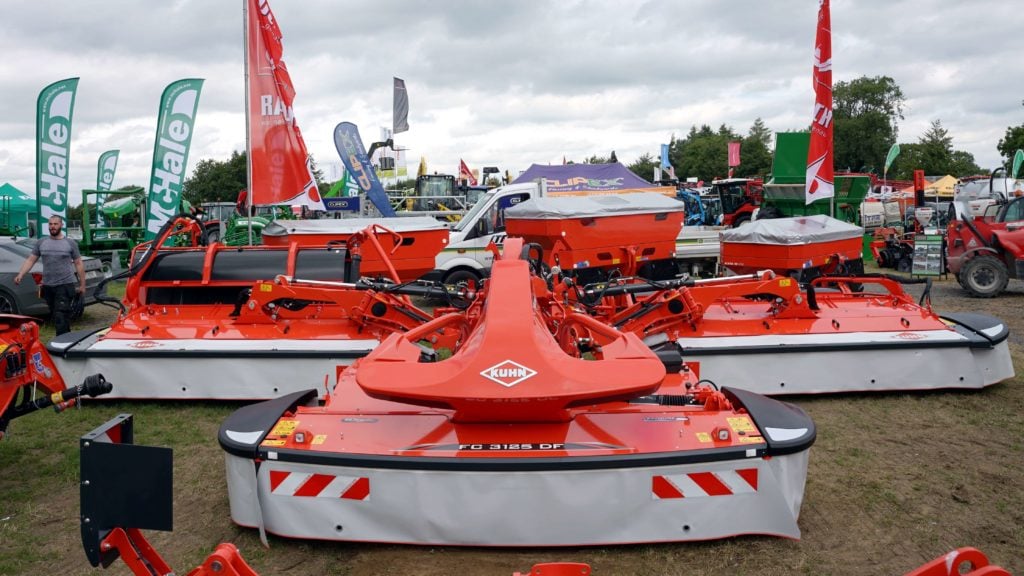 Kuhn's latest mower set features retractable hoods and aluminium frames for the grouper belts