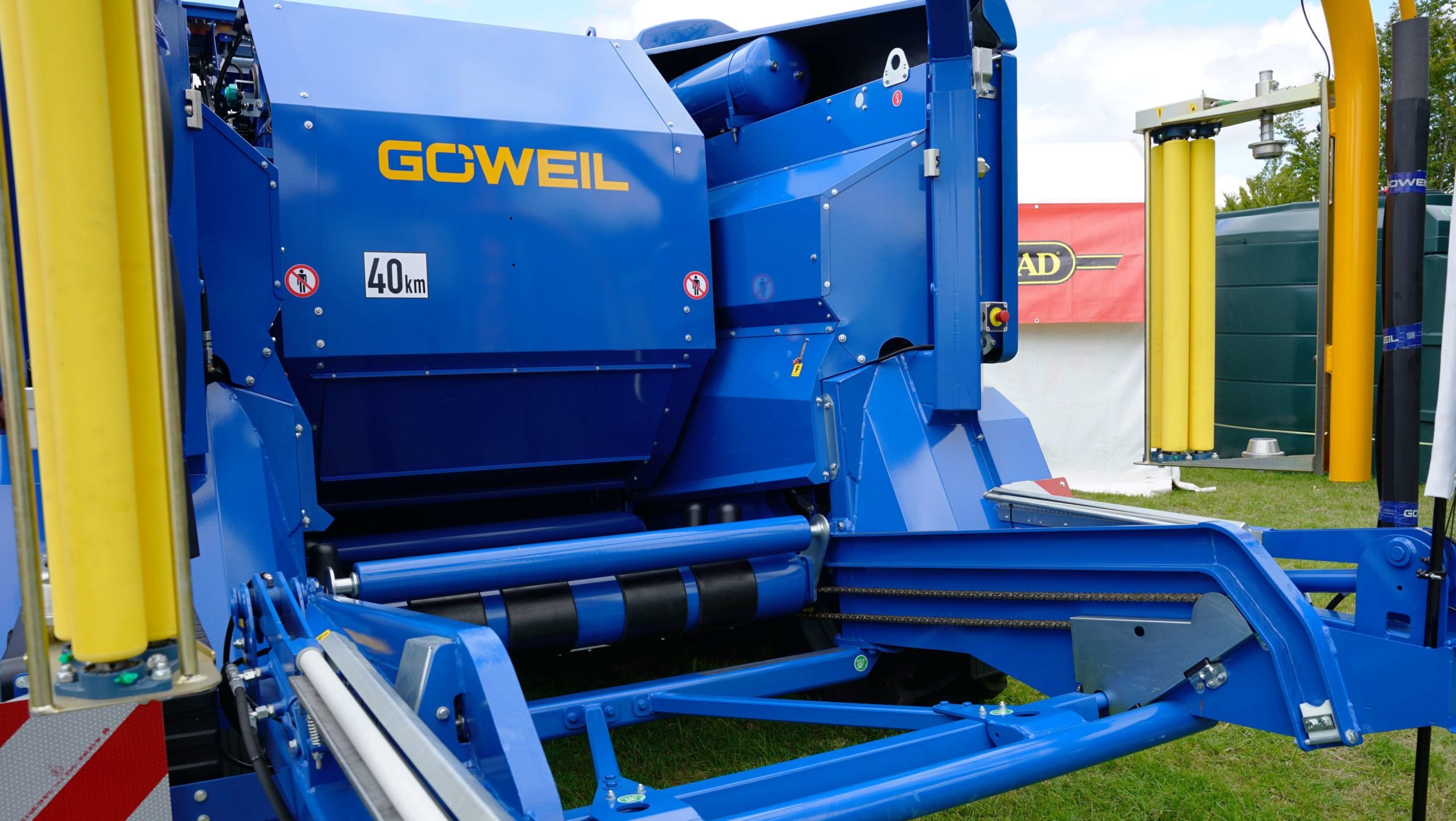 The bales are dropped gently onto a table which then transports them back to the wrapping unit
