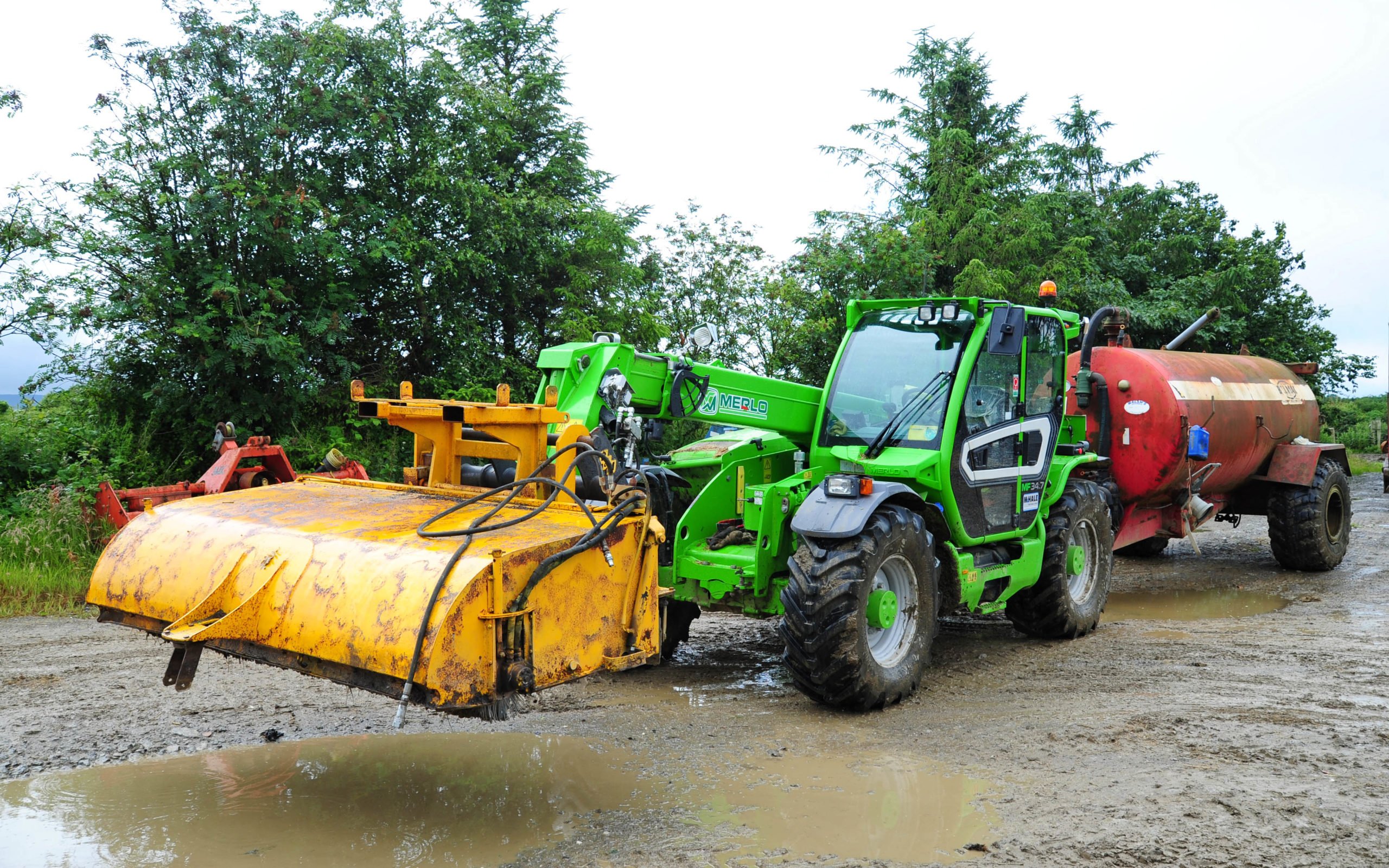 The Multifarmer is often pressed into road cleaning duties with rotary brush and tanker