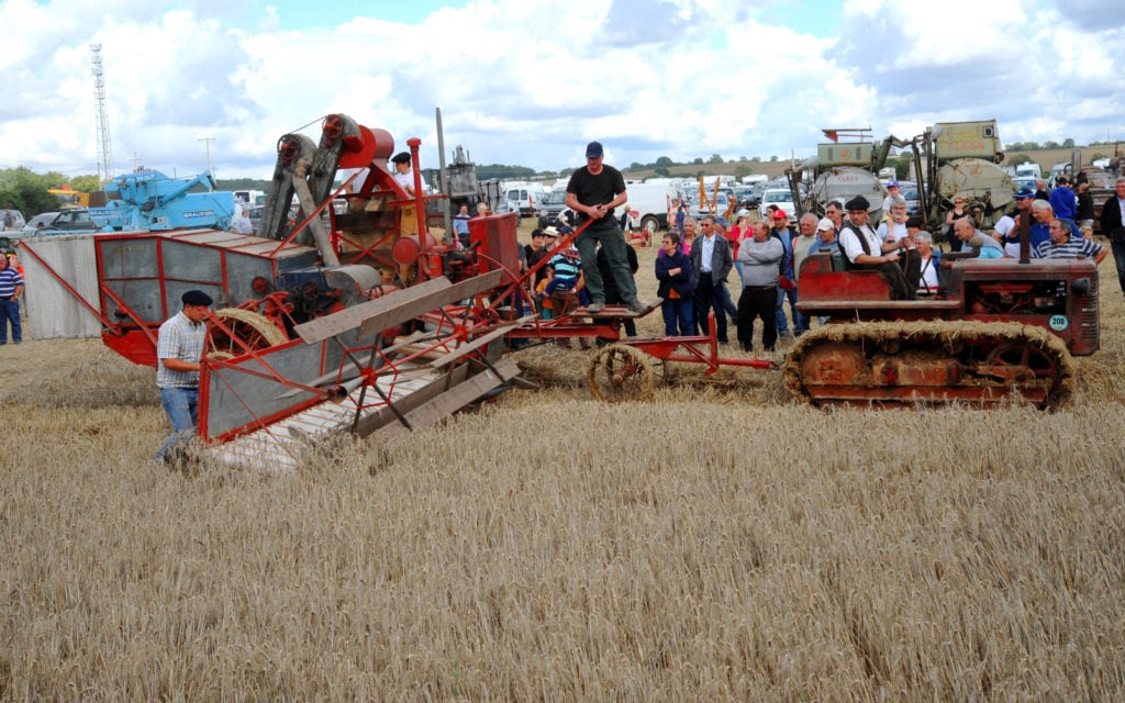 Up until the 1940s, most combine harvesters were drawn by horse or tractor with an auxiliary driving the mechanism