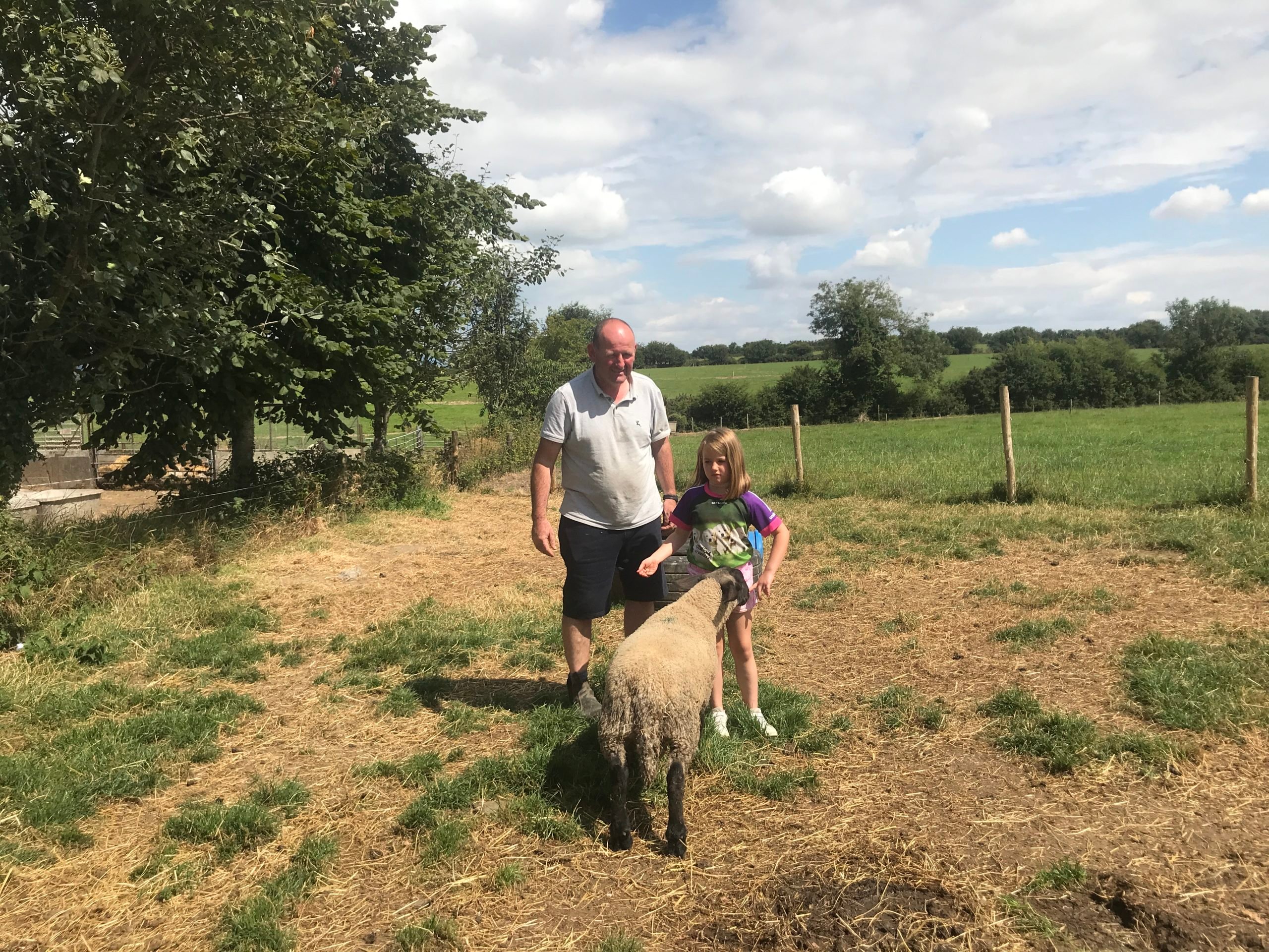 John and his daughter Clara with one of her pet lambs