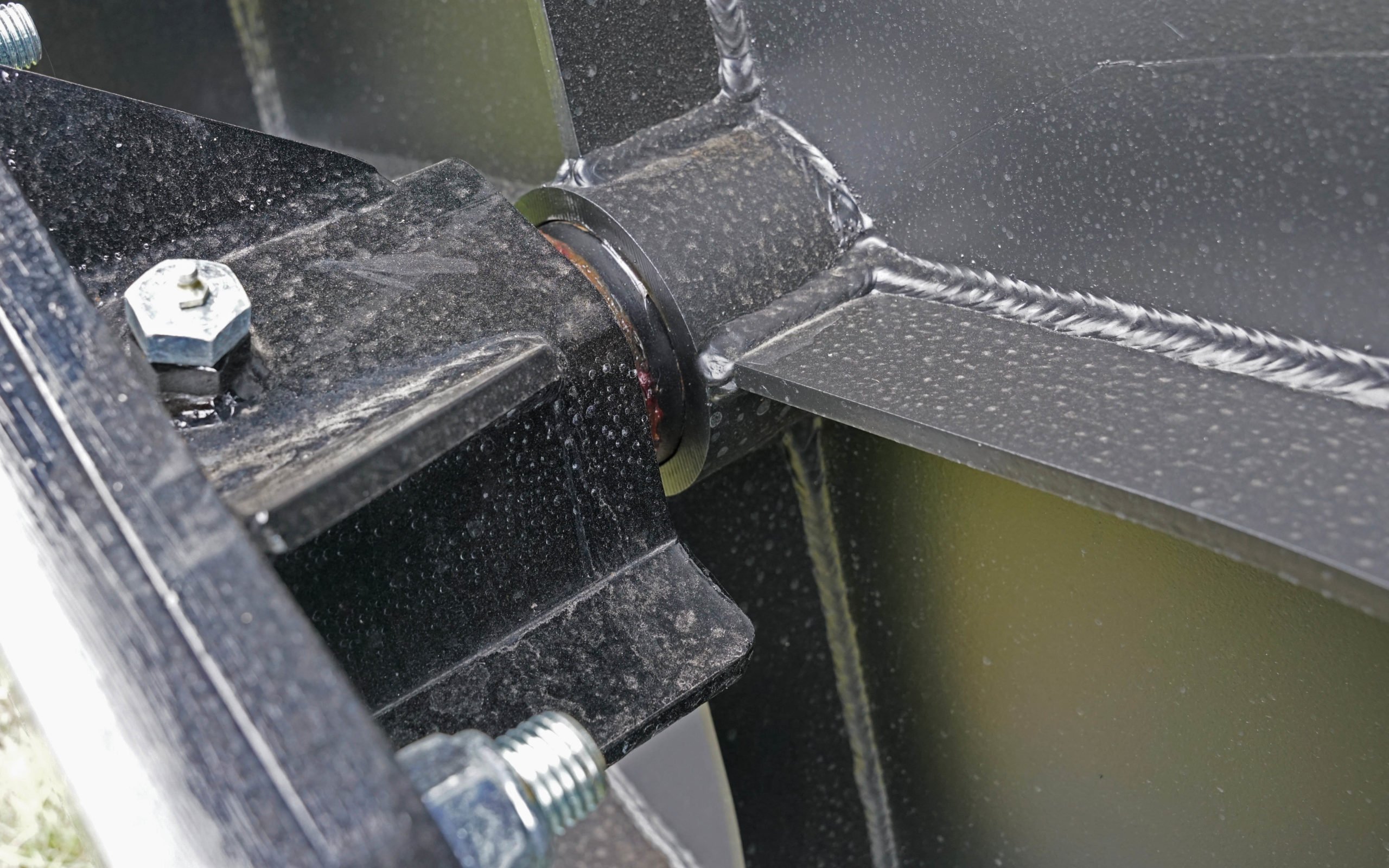 A nylon bearing is pressed into the a hexagonal housing to support the roller shaft