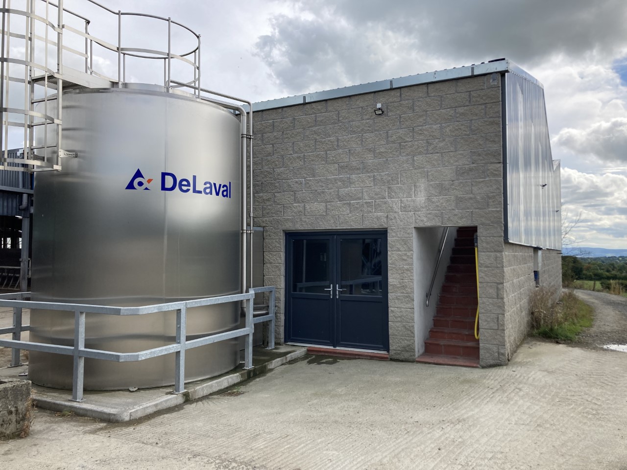 20,000L bulk tank. There is a smaller back-up tank inside the door to take milk from the robots while the 20,000L one is washing after a collection