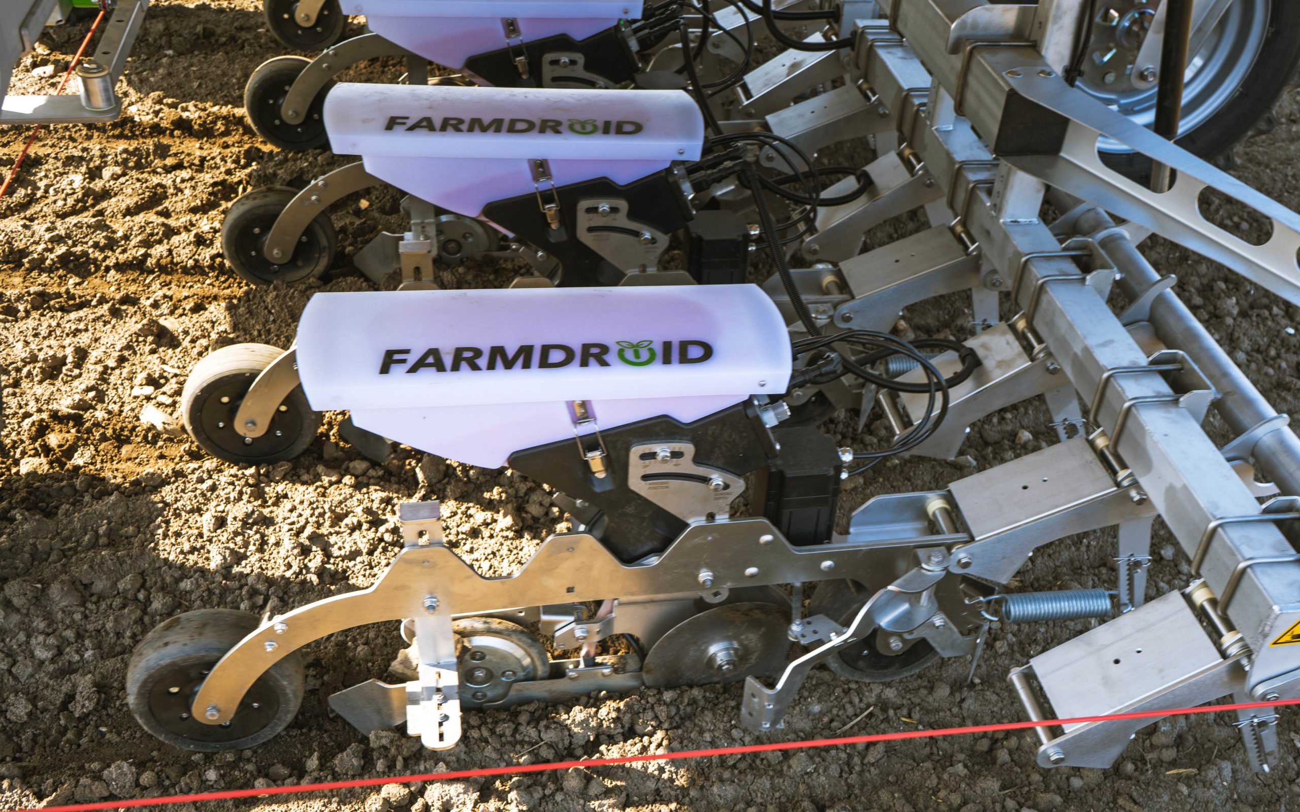 Once the field has been sown, the seed hoppers are tilted up to allow the weeding knife to operate freely