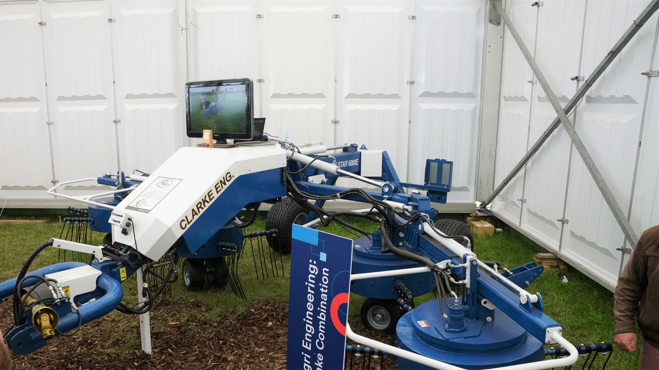 A dual purpose machine which can switch between tedding and gathering is intended to cost less than two separate machines