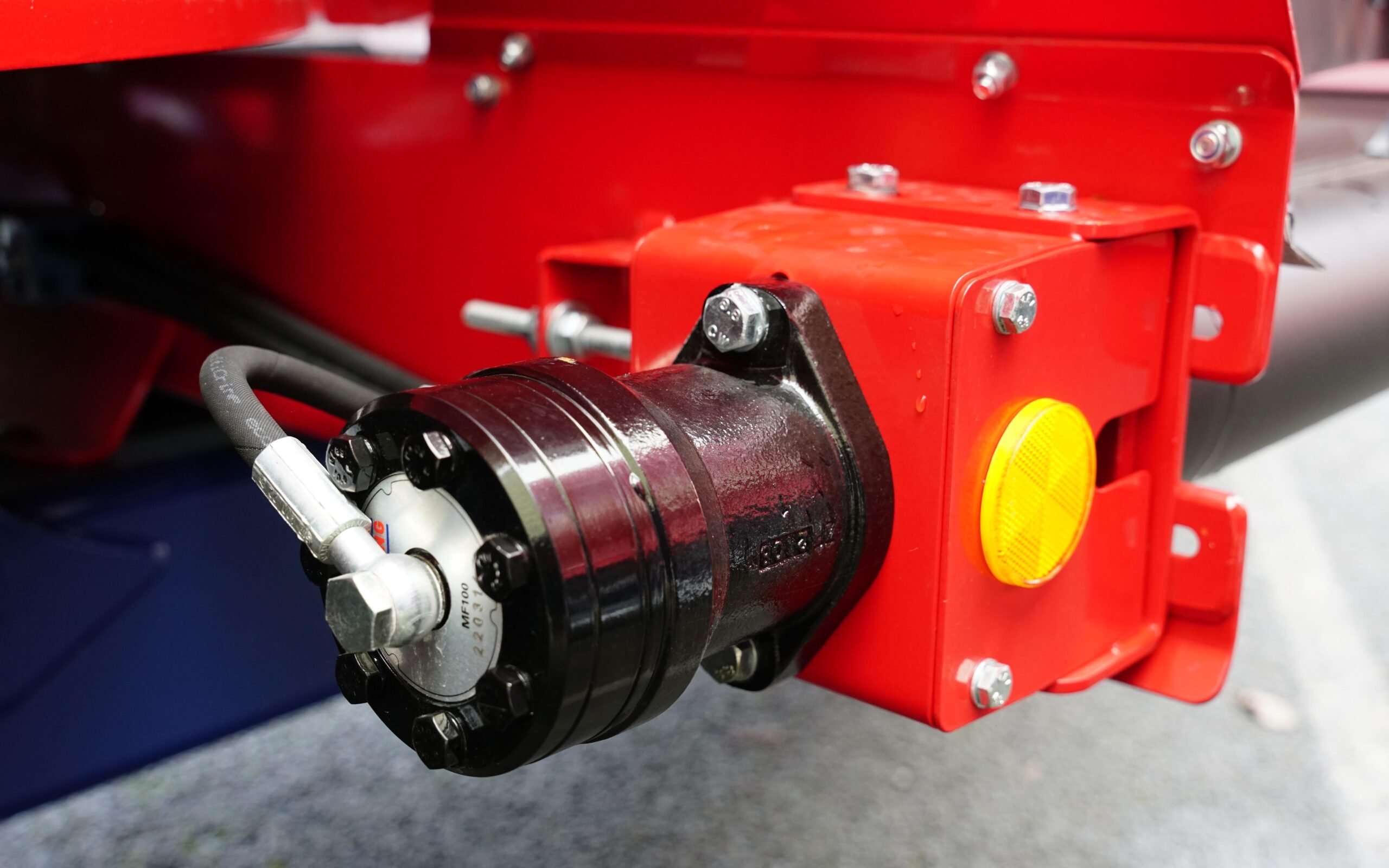 The relief valve is attached to end of the drive motors for the belts directs excess oil back to the rear axle