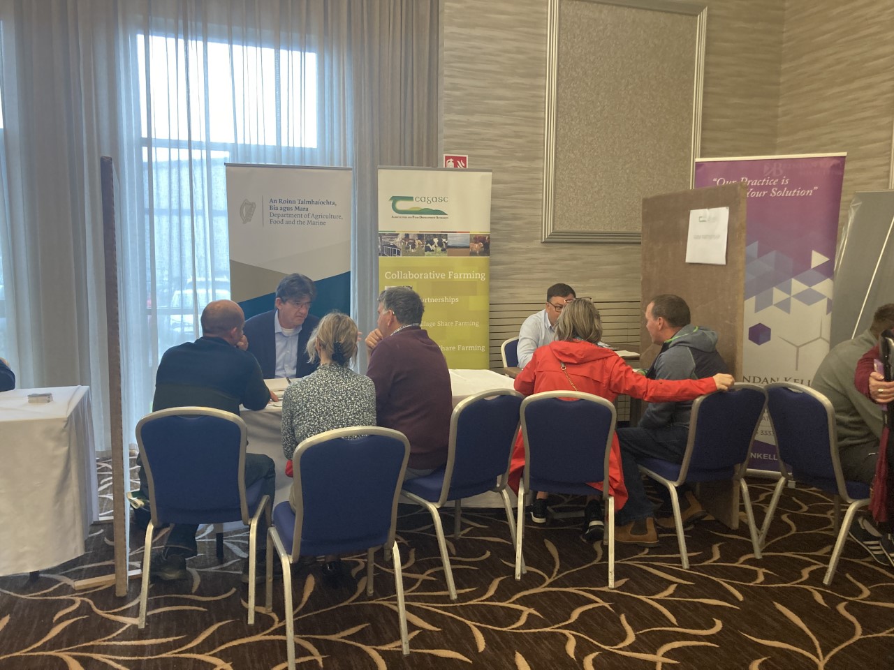 Farmers querying about Registered Farm Partnerships at the Transferring the Family Farm event in Letterkenny, Co. Donegal.