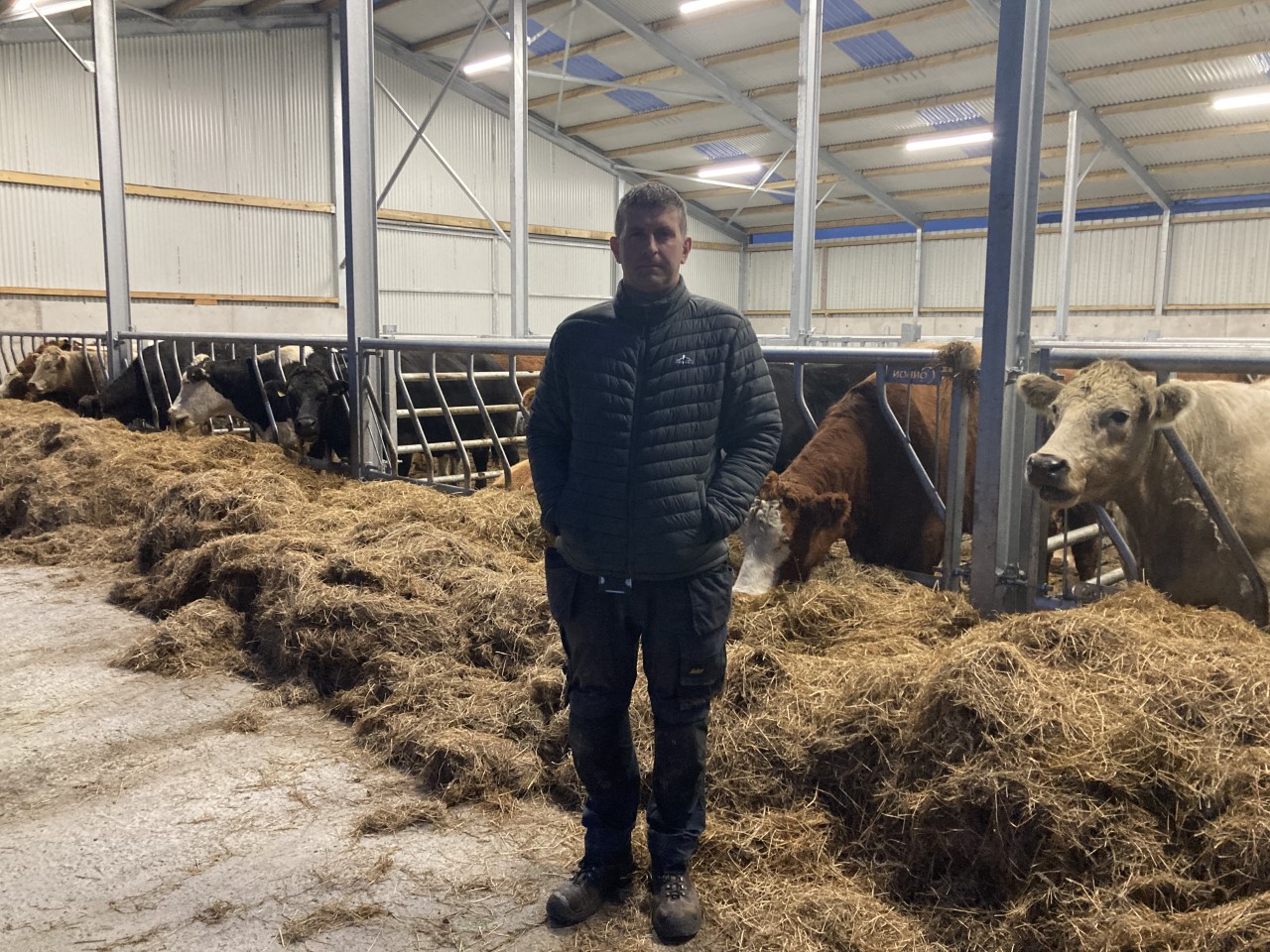 Aidan Cahill standing in front of his new shed